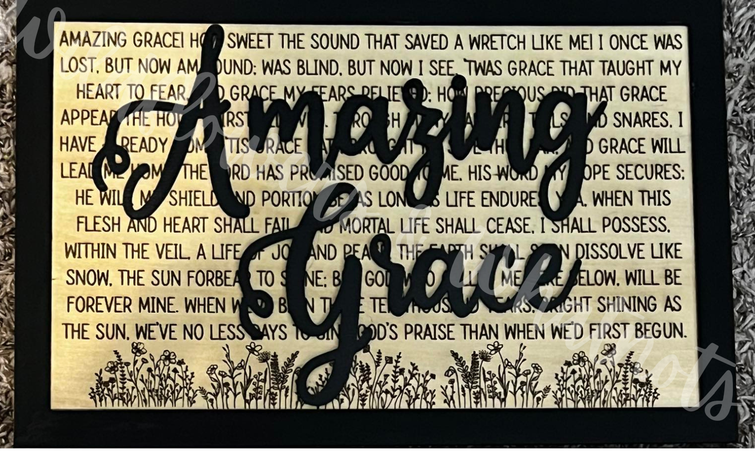 Decorative sign with 'Amazing Grace' wooden text over the lyrics with a floral design on a black wood back. Customizable Size and Color.