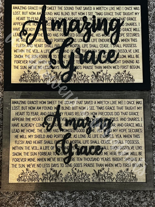 Decorative 'Amazing Grace' wooden text over lyrics and floral print on a wood surface. Customizable size font, Colors and Backplate in Natural or Colored. 